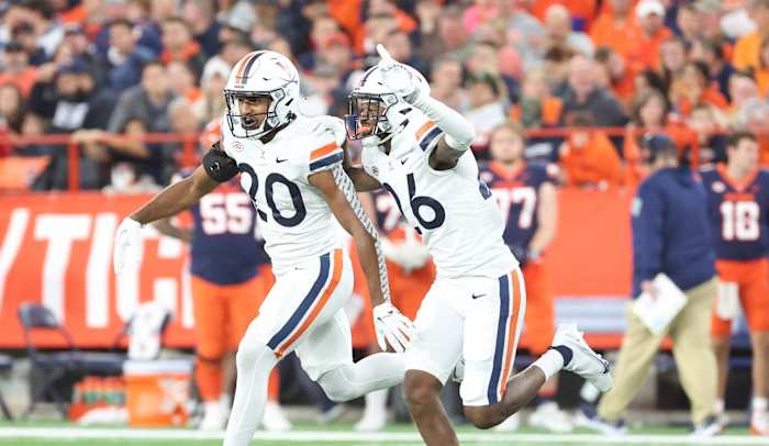 Virginia Cavaliers defensive backs Jonas Sanker and Jaylon Baker celebrate after forcing a turnover against the Syracuse Orange.